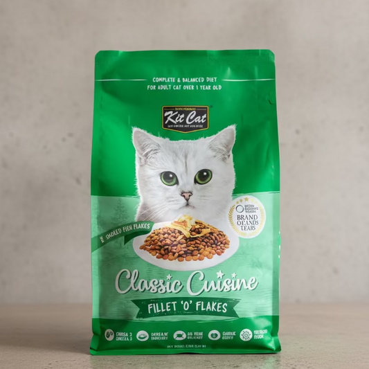 Green package of Kit Cat Classic Cuisine cat food on a cement surface