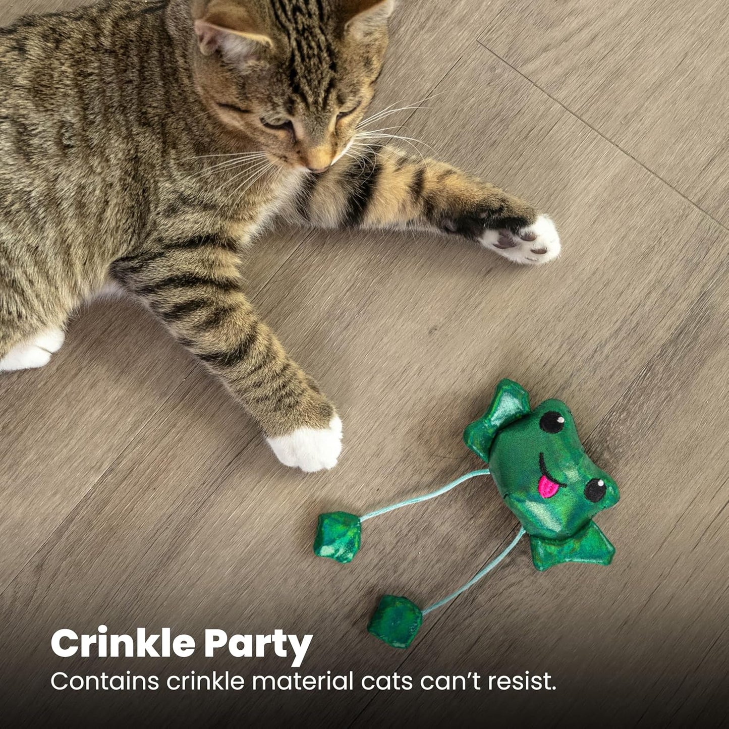 Tabby cat playing with the Petstages Toss 'N Dangle Frog catnip cat toy