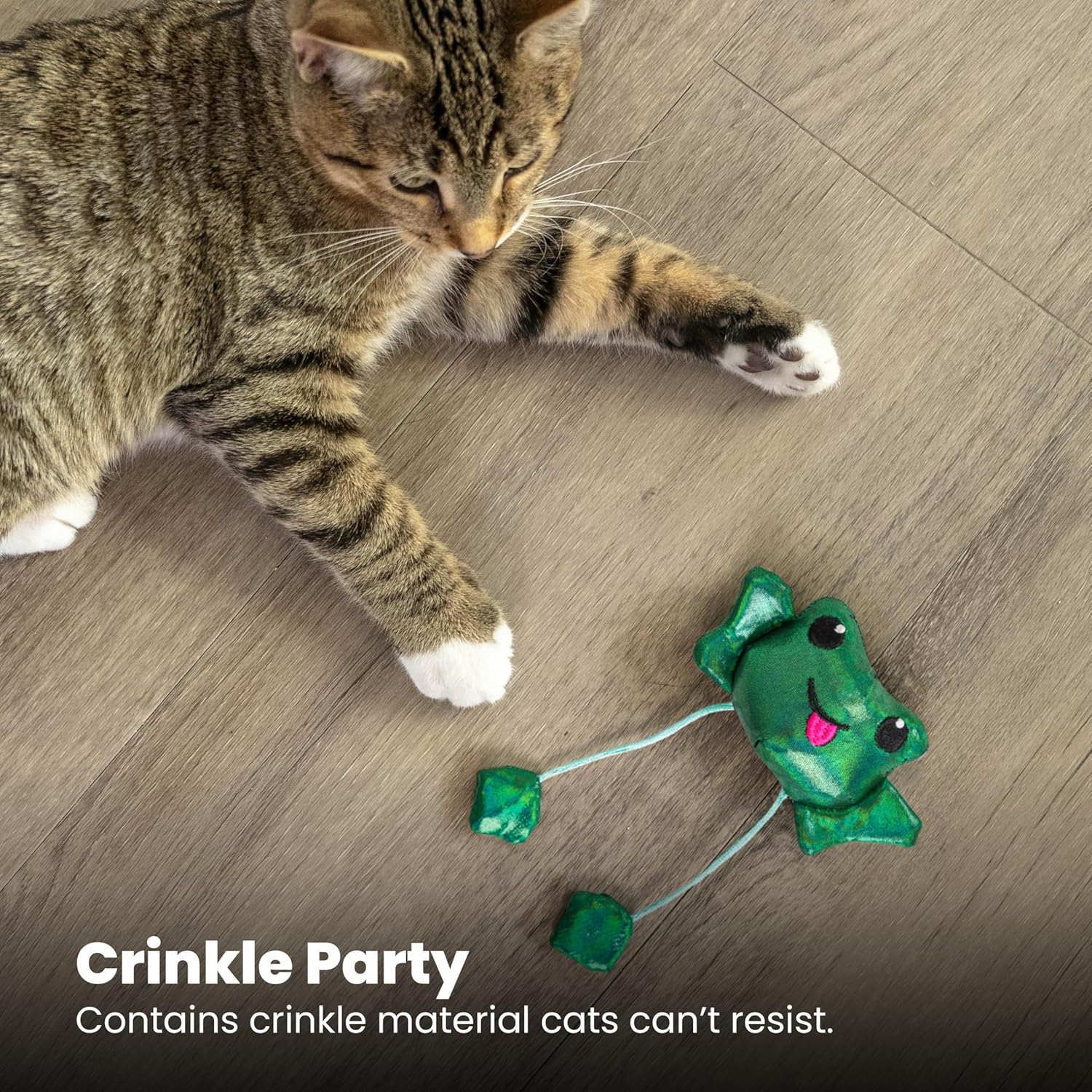 Tabby cat playing with the Petstages Toss 'N Dangle Frog catnip cat toy