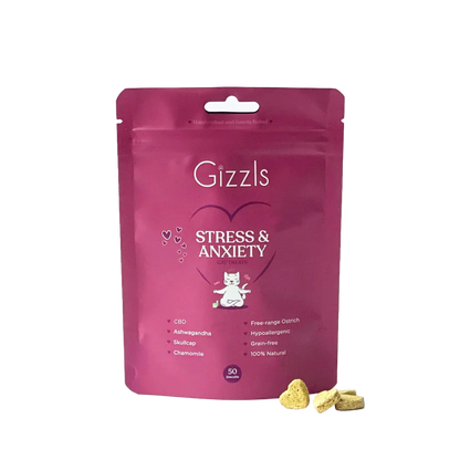 A pink stand-up pouch of Gizzls Stress & Anxiety cat treats, with three small yellowish treats. 