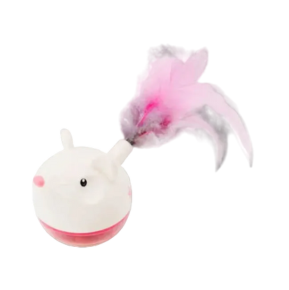 White and pink toy with a feather on a white background