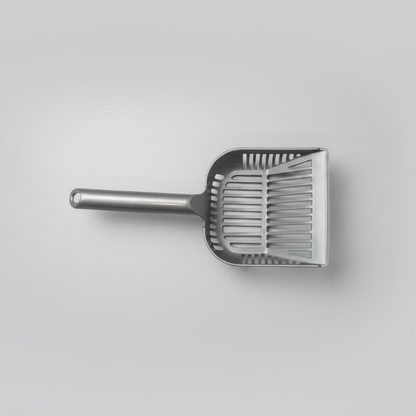 A gray cat litter scoop on a white background 