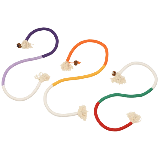 Colorful cat chew toys on a yellow background with text about cat chewing fun.