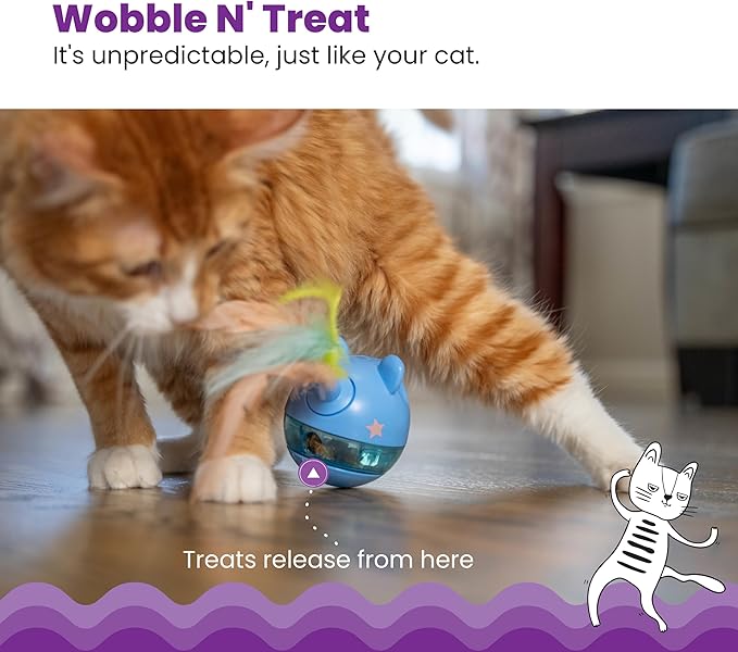 Orange cat playing with wobble treat dispenser toy