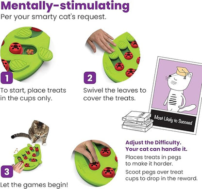 Green leaf-shaped cat puzzle treat feeder with red ladybug pegs, instruction graphic