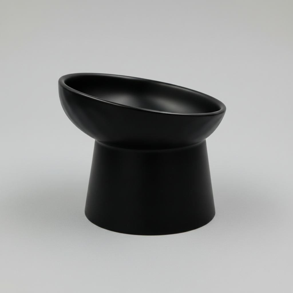 Black elevated ceramic pet bowl with slanted design for cats