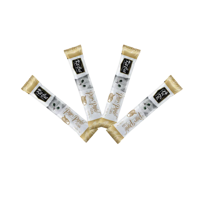Four Kit Cat purr puree treat packages with a cat illustration on a white background