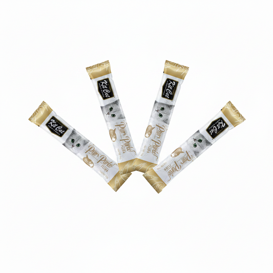 Four Kit Cat purr puree treat packages with a cat illustration on a white background