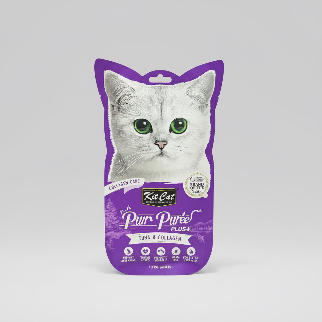 Purple package of Kit Cat Pur Péree Plus+ tuna and collagen cat food on a wooden surface.
