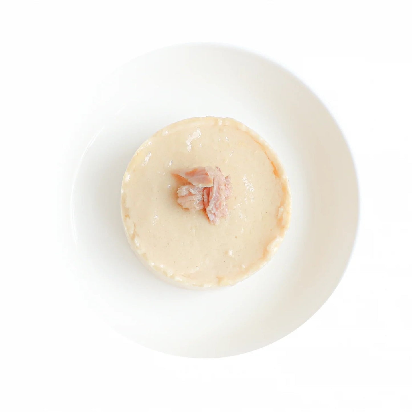Close-up of Kit Cat Chicken Mousse with Tuna Topper showing its smooth, creamy texture.