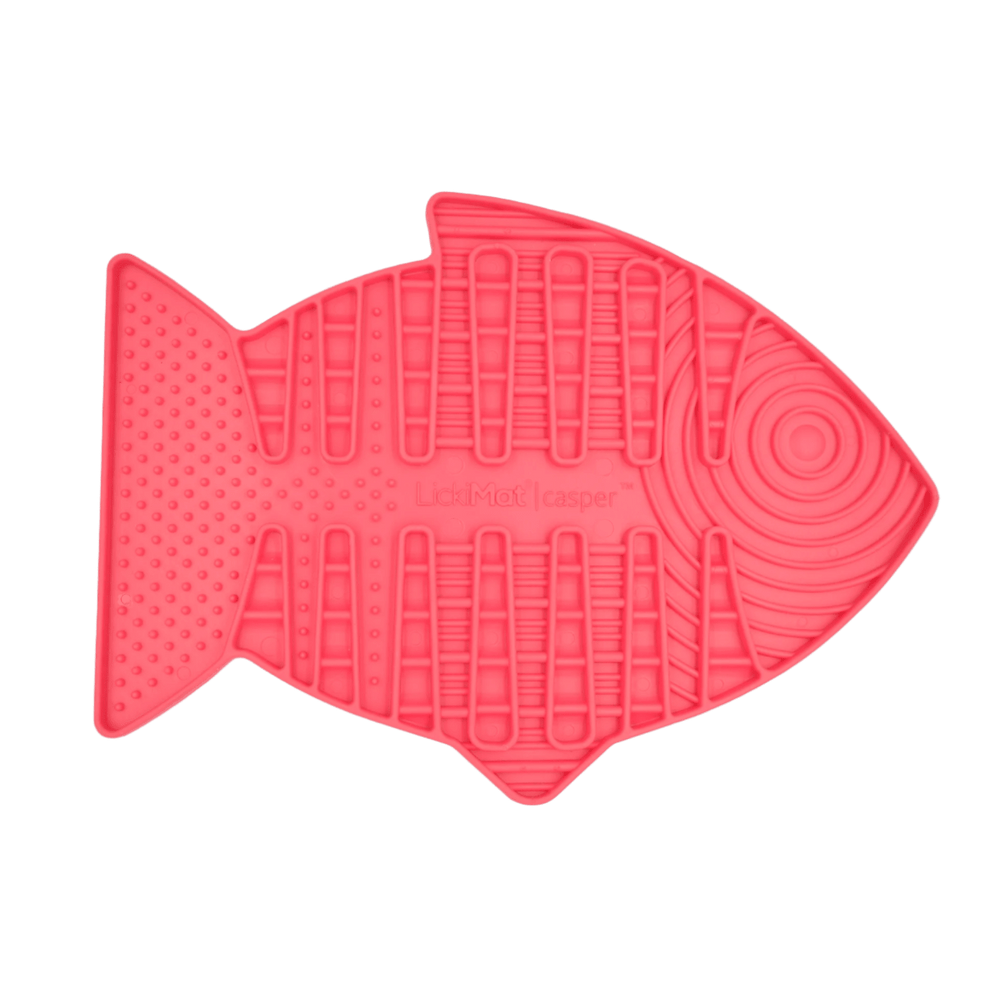 Pink fish-shaped slow feeder mat with raised lick channels and circular swirl