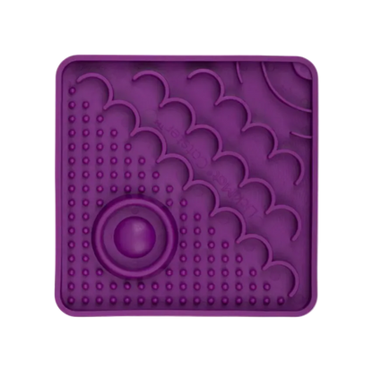 Purple LickiMat Catster slow feeder for cats with textured enrichment feeding surface and hydration well.