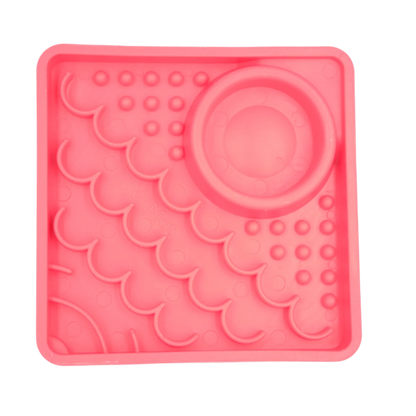 Pink LickiMat Kitty slow feeder for kittens with hydration well and textured enrichment feeding zones.