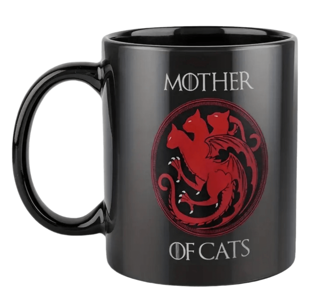 Black ceramic mug with handle, red cat logo, and 'MOTHER OF CATS' lettering
