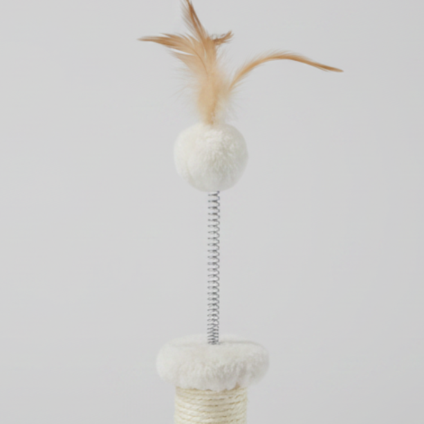 Close-up of feather pom-pom toy on M-PETS Kitten Feather Cat Tree in white