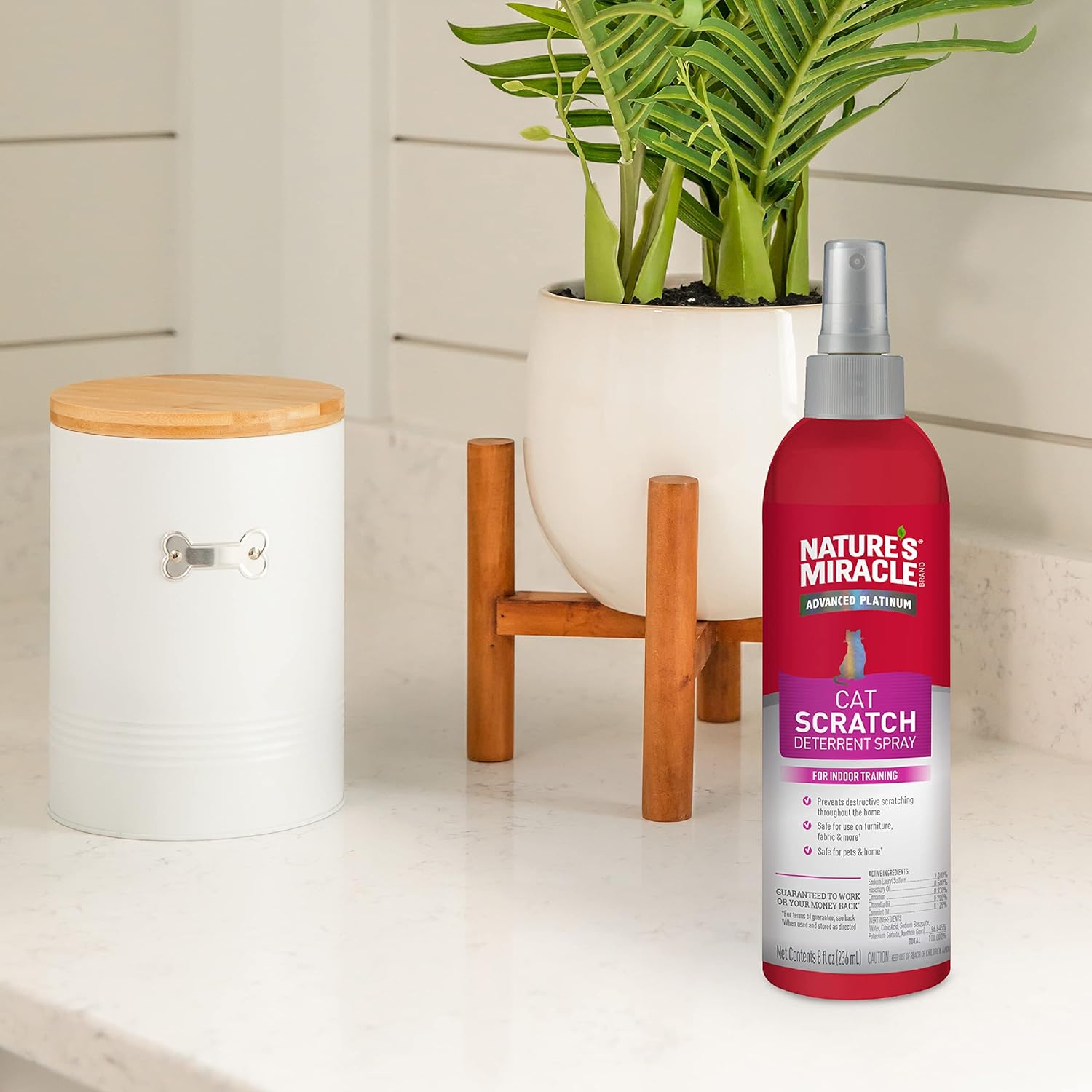 Nature’s Miracle Cat Scratch Deterrent 236ml bottle displayed in a home interior