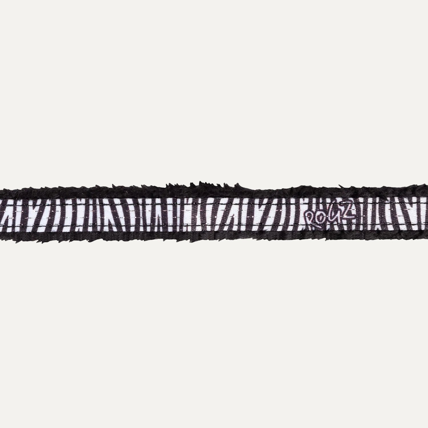 Close-up of Rogz FashionCat Safety Collar in Zebra print with black and white safari-inspired pattern