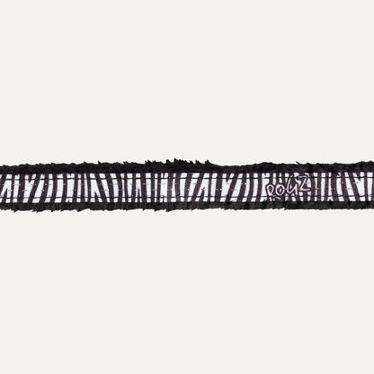 Close-up of Rogz FashionCat Safety Collar in Zebra print with black and white safari-inspired pattern