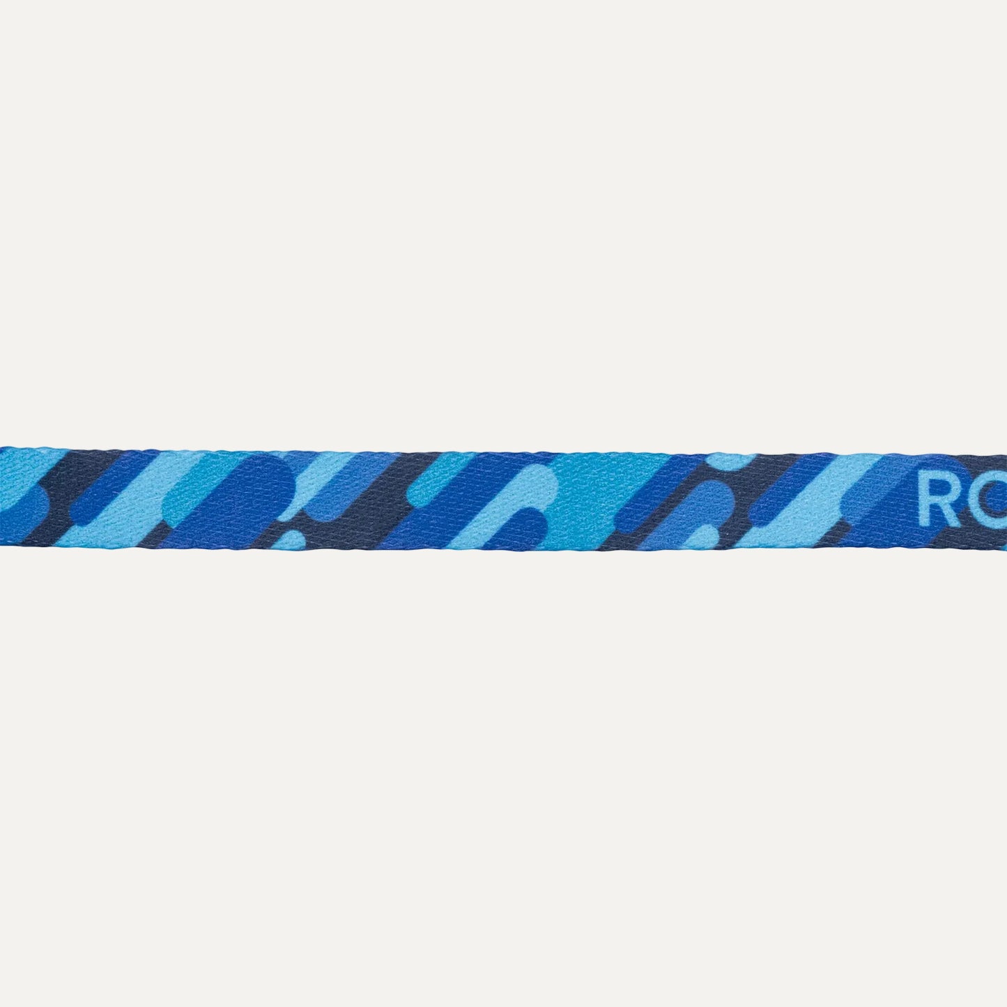 Close-up of Rogz FusionCat Classic Safety Collar in Geo Blue showing the blue graphic print pattern