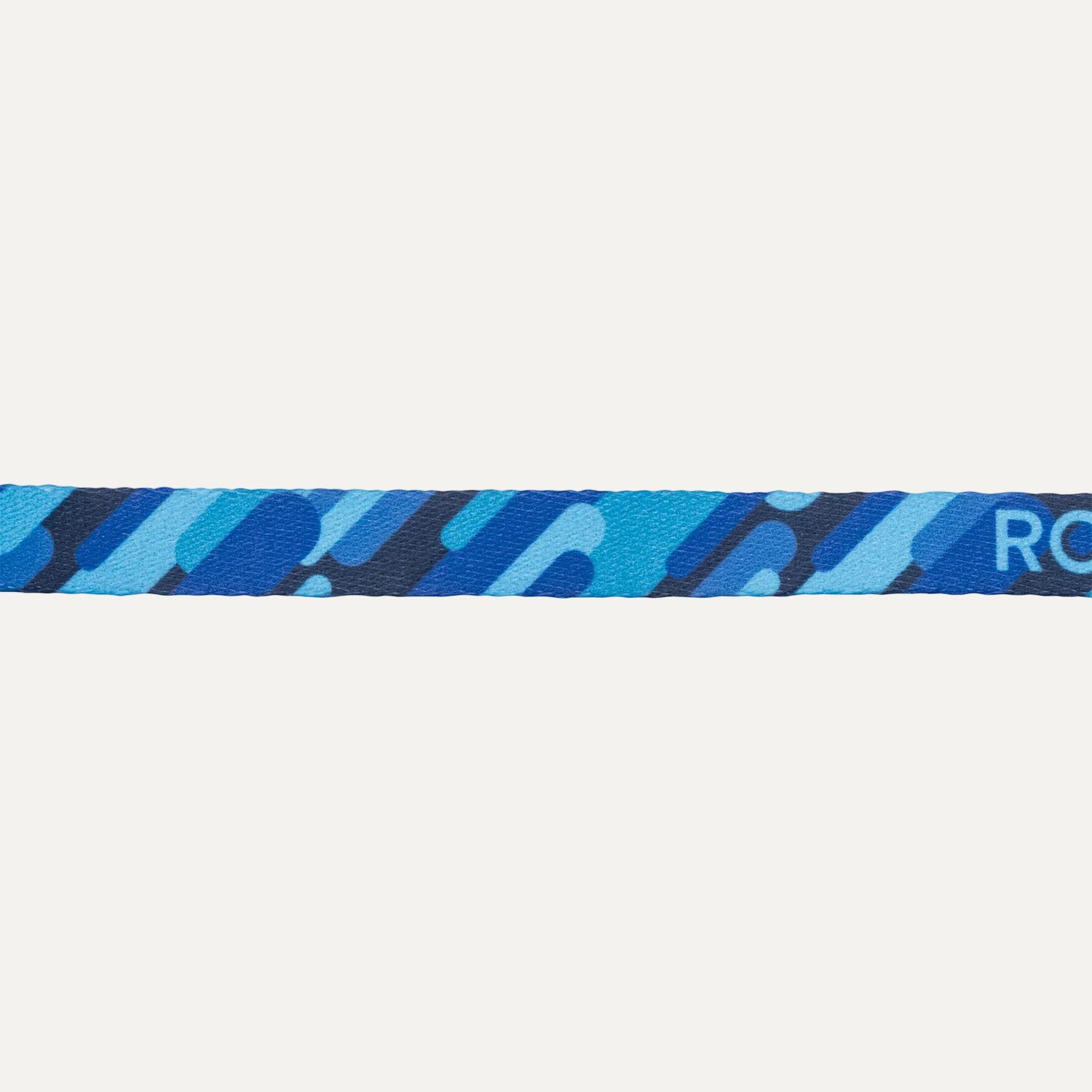 Close-up of Rogz FusionCat Classic Safety Collar in Geo Blue showing the blue graphic print pattern