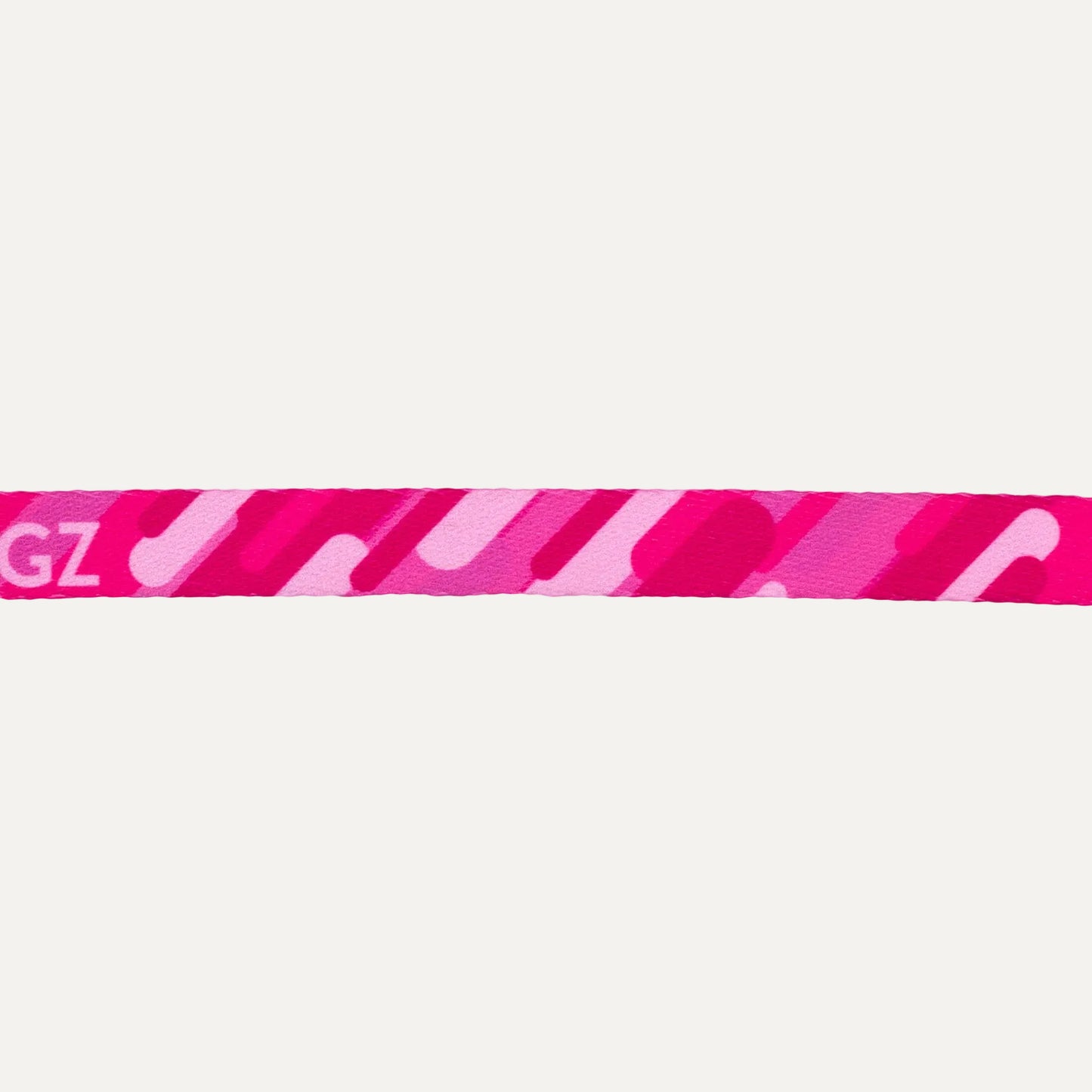 Close-up of Rogz FusionCat Classic Safety Collar in Geo Pink showing the pink graphic print pattern