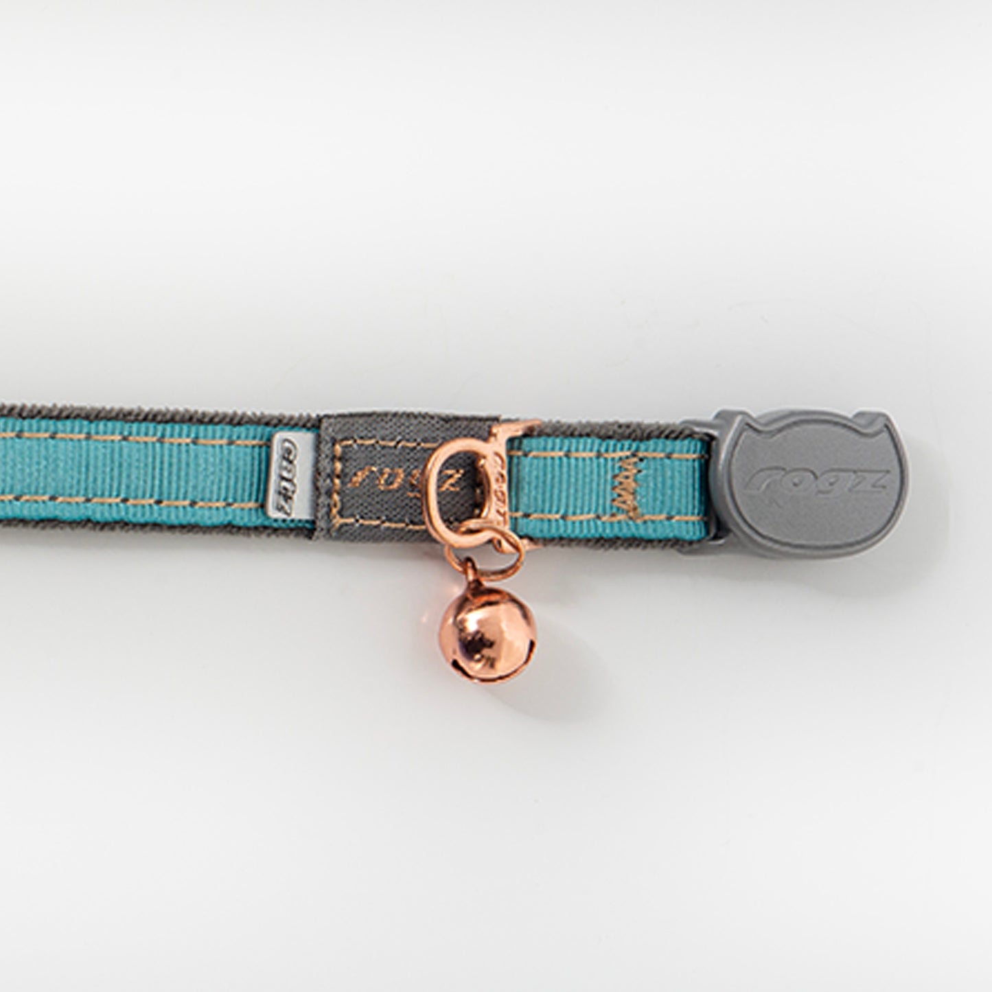 Close-up of Rogz UrbanCat Safety Collar in Turquoise Moon with rose gold bell, soft plush webbing and breakaway safety buckle