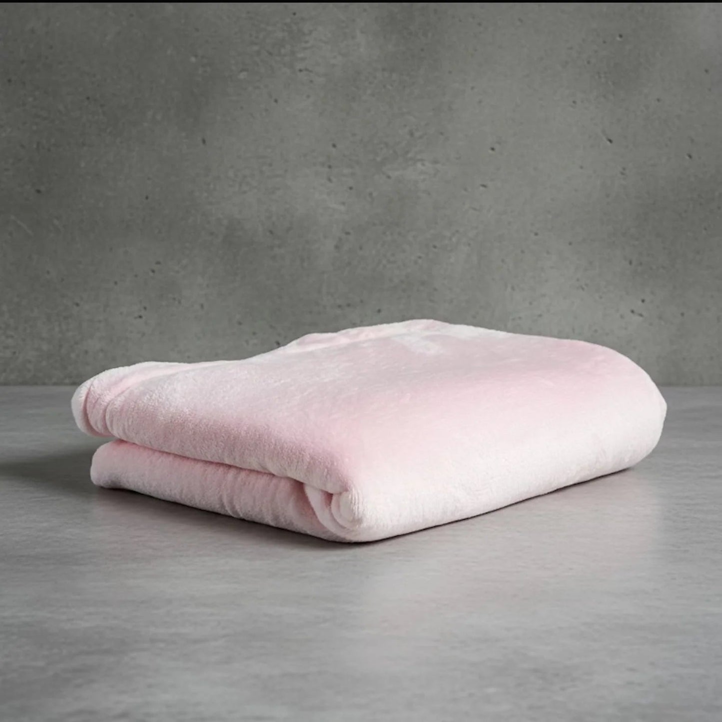 Folded light pink Shears double-fleece cat comfort blanket on a neutral grey background