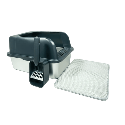 Pet litter box with scoop and additional litter on a white background