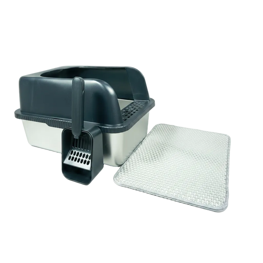 Pet litter box with scoop and additional litter on a white background