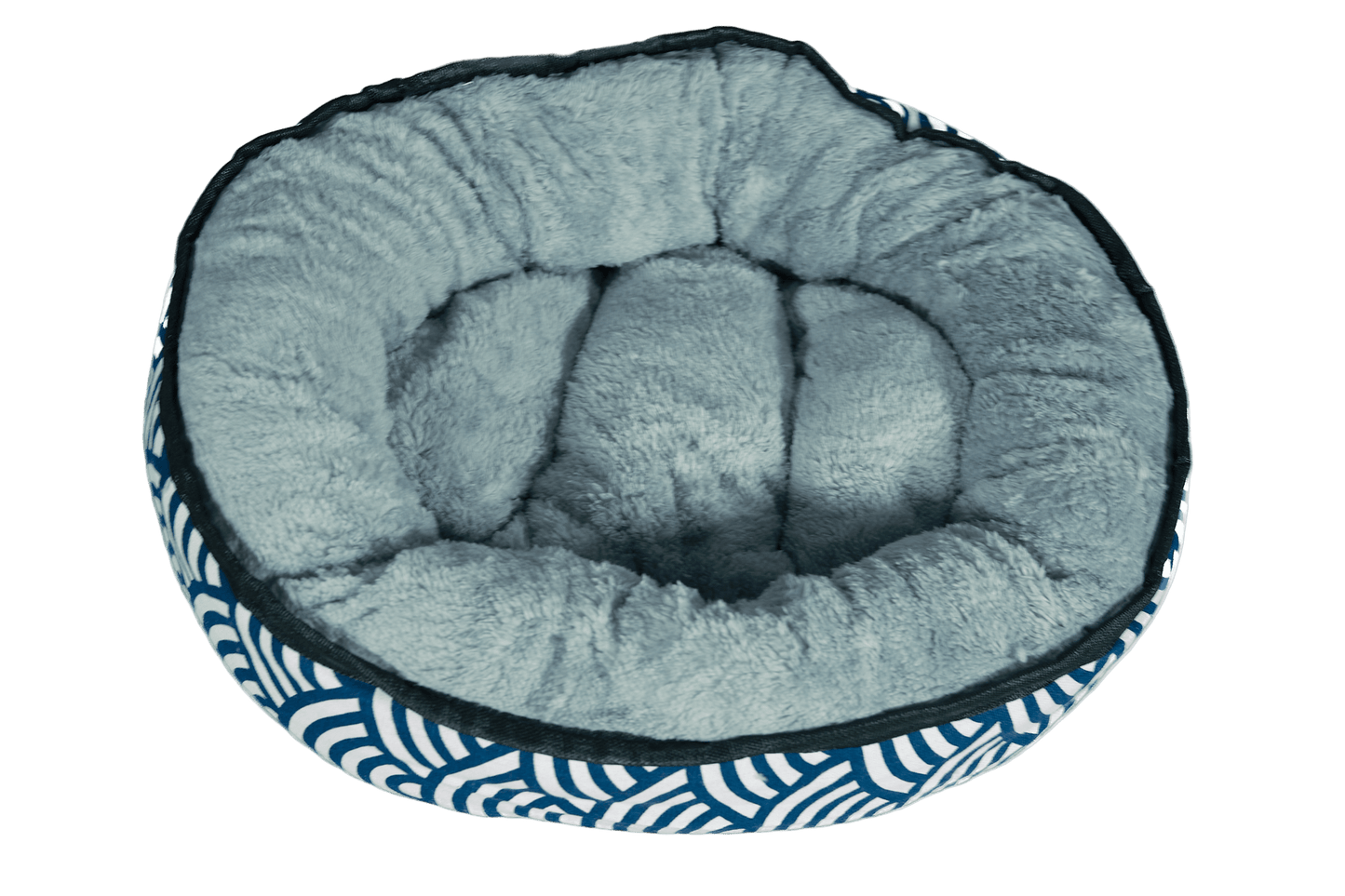 Reversible plush kitten bed with light gray cushioned interior and blue wave sides
