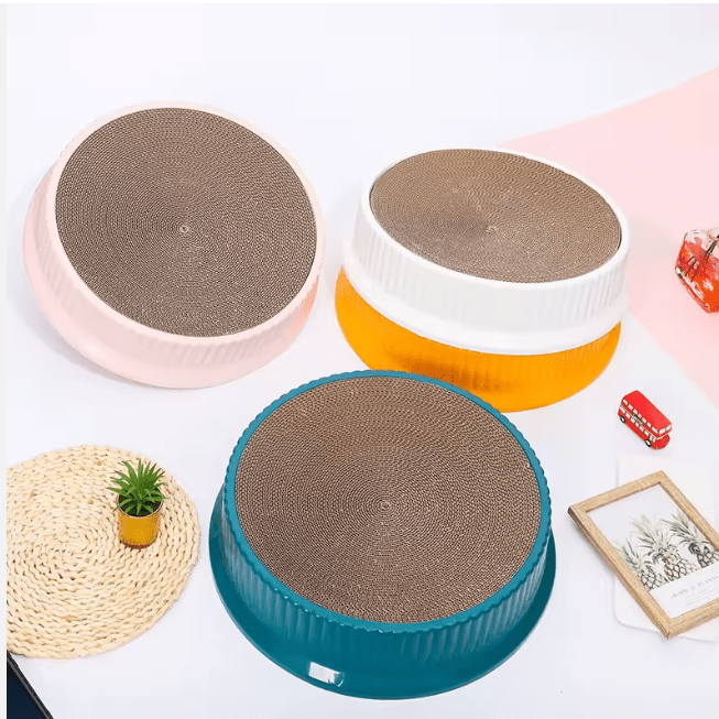 Round cat scratcher bed, gray top, on white, orange, and teal bases