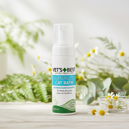 Vet's Best Waterless Cat Bath product on a wooden surface with greenery in the background