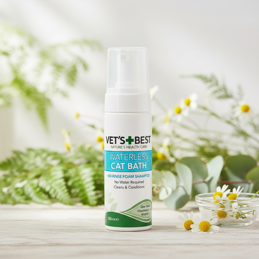 Vet's Best Waterless Cat Bath product on a wooden surface with greenery in the background